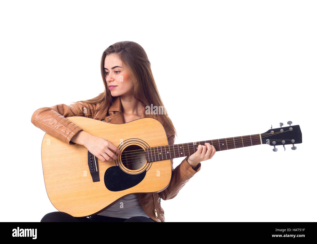 Junge Frau mit einer Gitarre Stockfoto