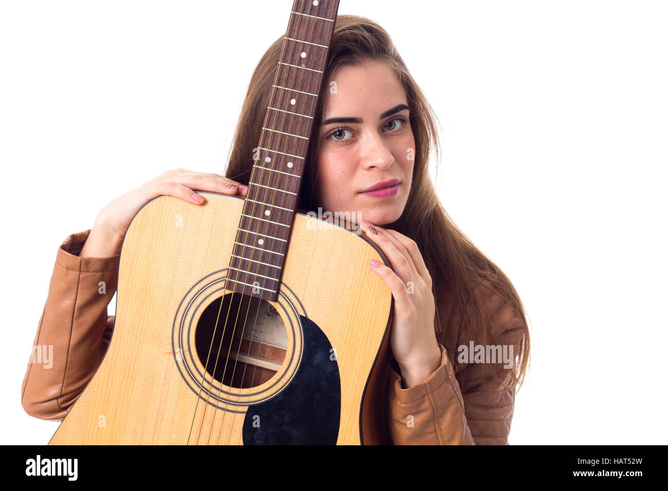 Junge Frau mit einer Gitarre Stockfoto