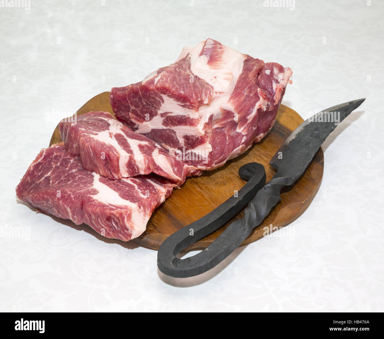 Steak, Messer, rohes Fleisch Stockfoto