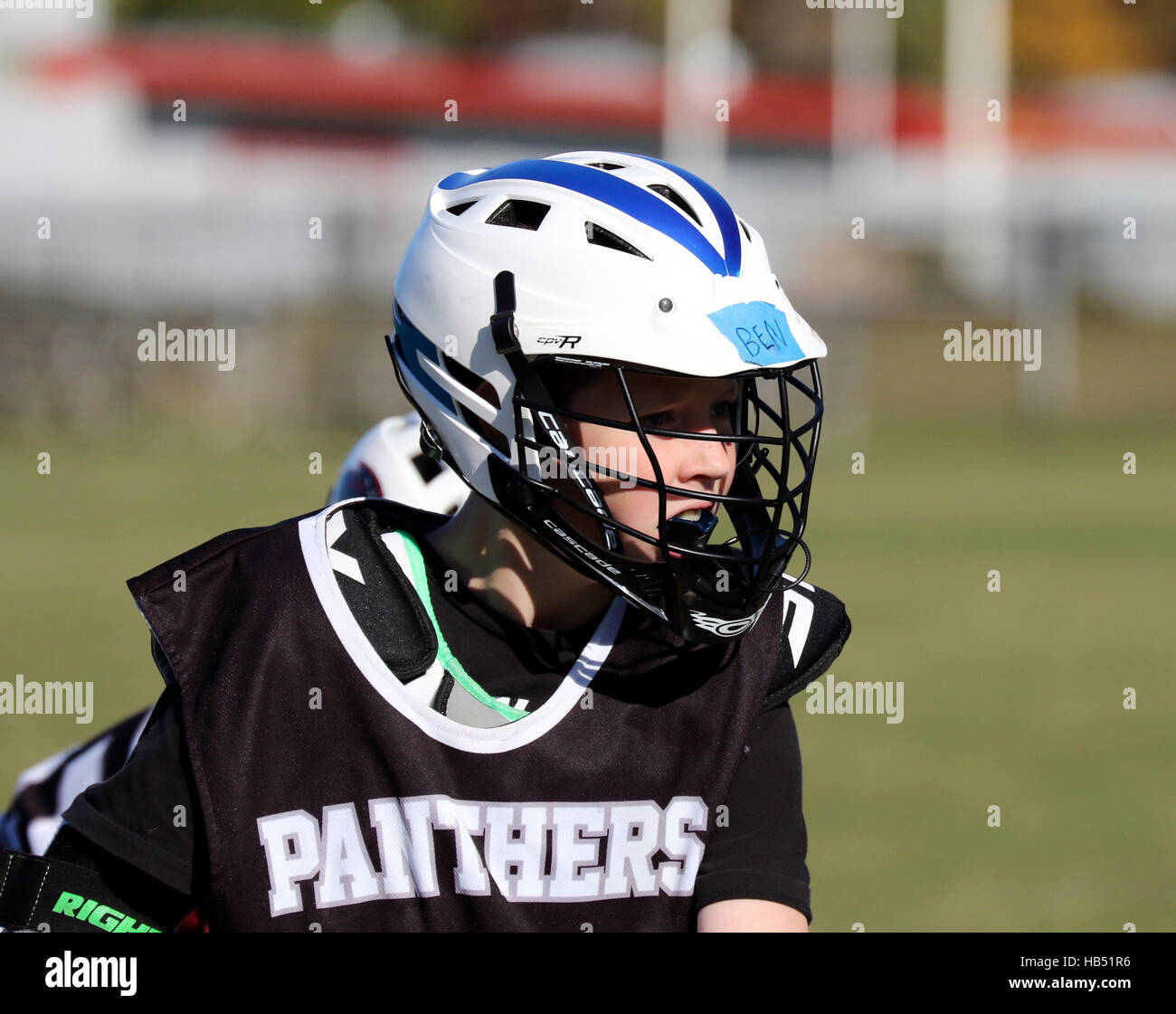 10 zehn Jahre alten Spielen Lacrosse Stockfoto