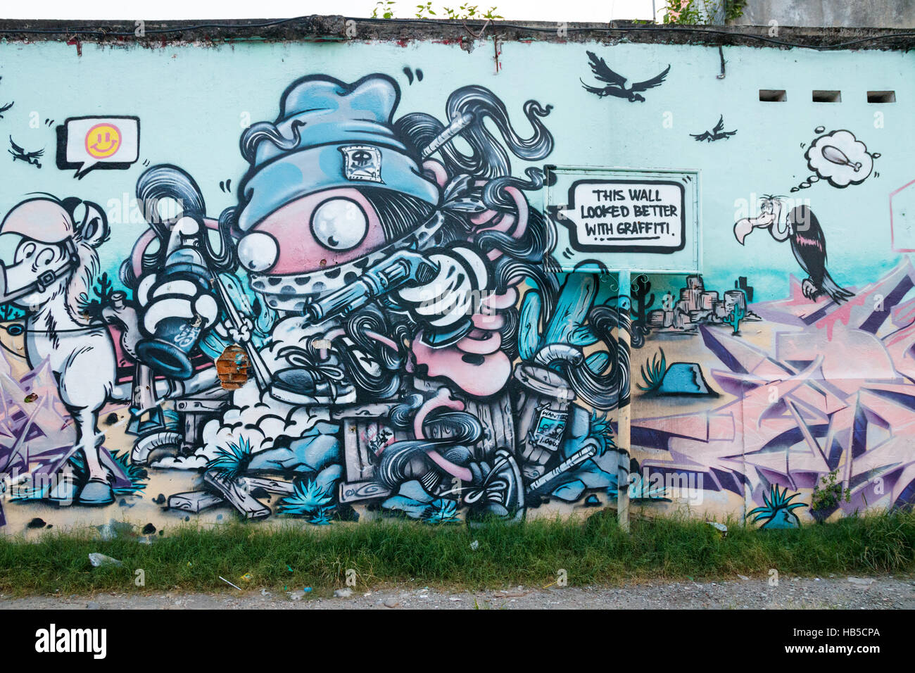 Street Art an einer Wand in Yogyakarta. Die Street Art in Yogyakarta hat oft eine politische Botschaft. Java, Indonesien. Stockfoto