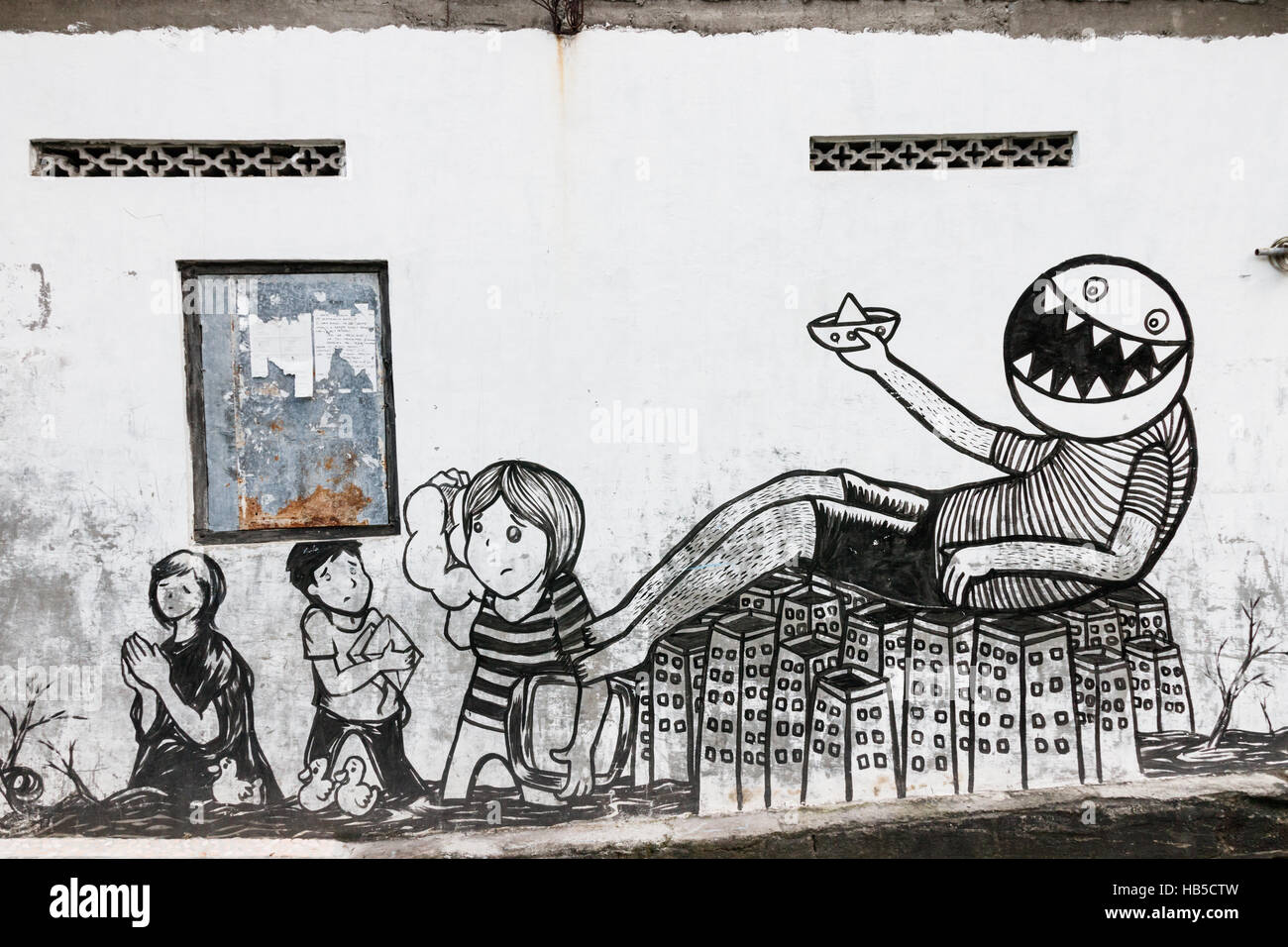 Graffiti in einem armen Viertel in Yogyakarta. Graffiti in Yogyakarta hat oft eine politische Botschaft. Java, Indonesien. Stockfoto