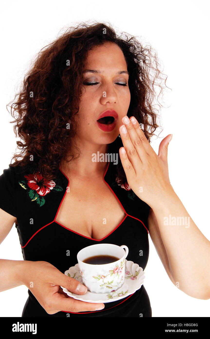 Müde Frau mit Kaffeetasse. Stockfoto