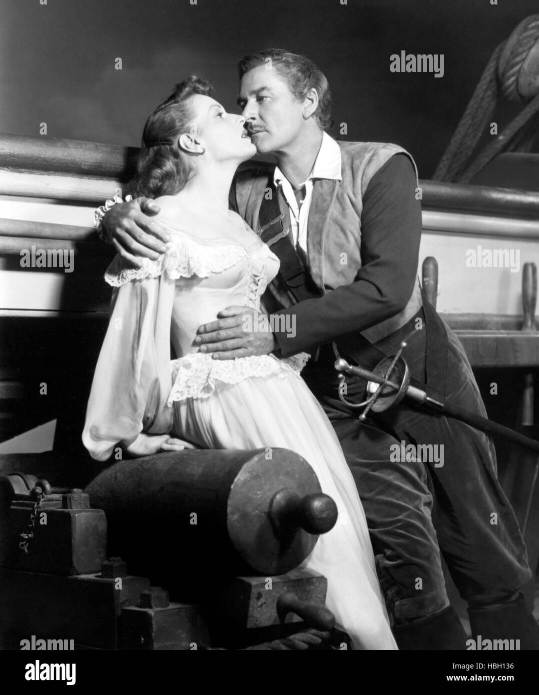 GEGEN alle Flaggen l-r: Maureen O'Hara, Errol Flynn, 1952. Stockfoto