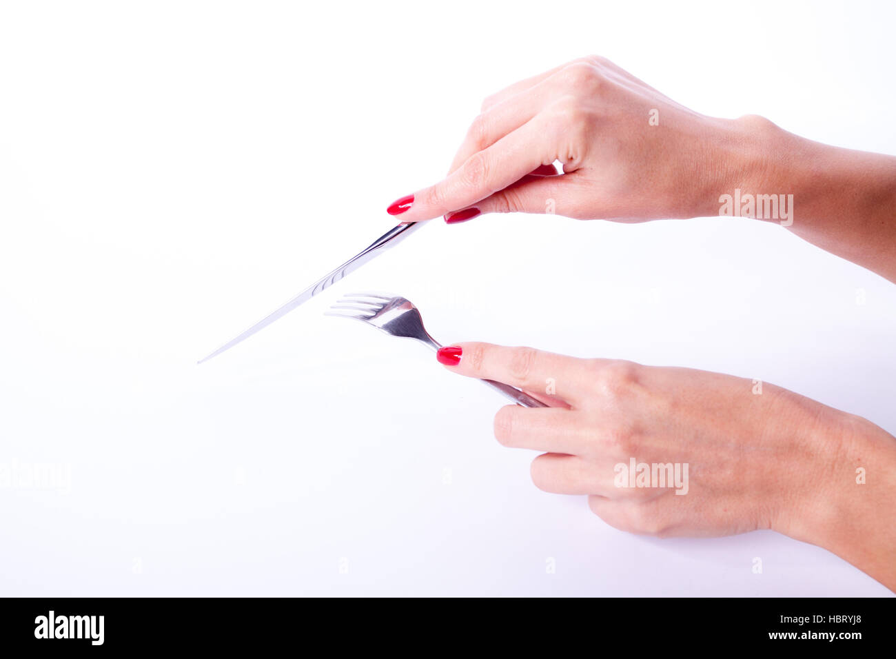 Frau Hand mit Messer und Gabel Stockfoto