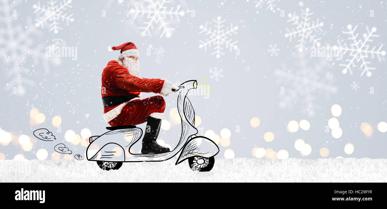 Weihnachtsmann auf Roller Stockfoto