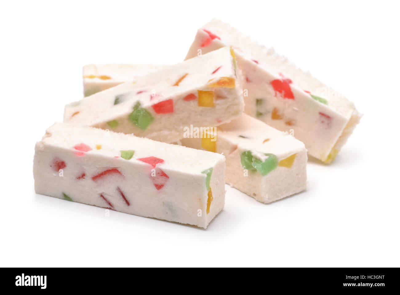 Obst-Nougat-Sticks isoliert auf weiss Stockfoto