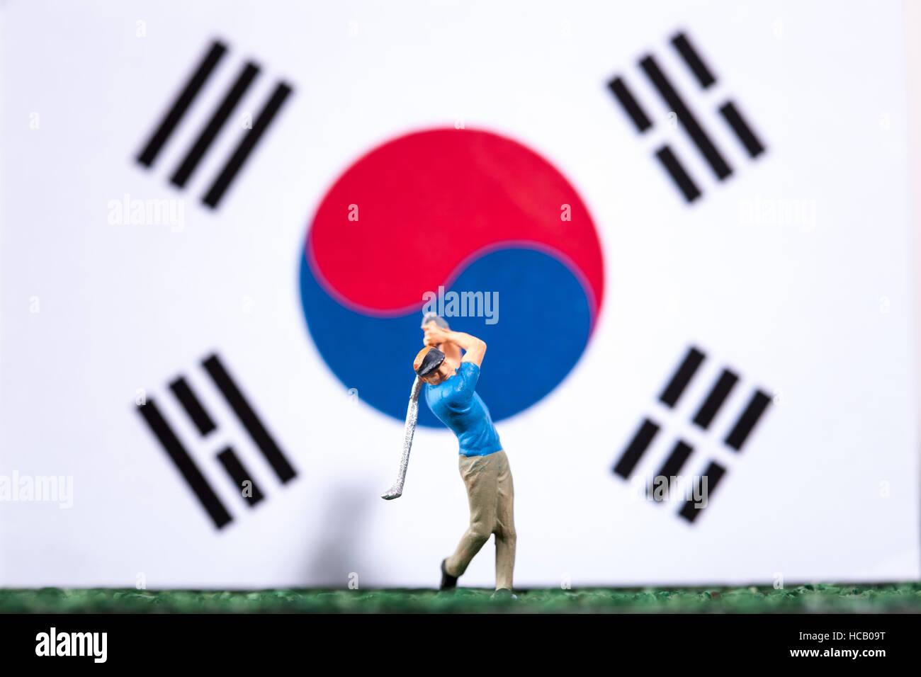 Abbildung der Golfspieler gegen koreanische Flagge Stockfoto