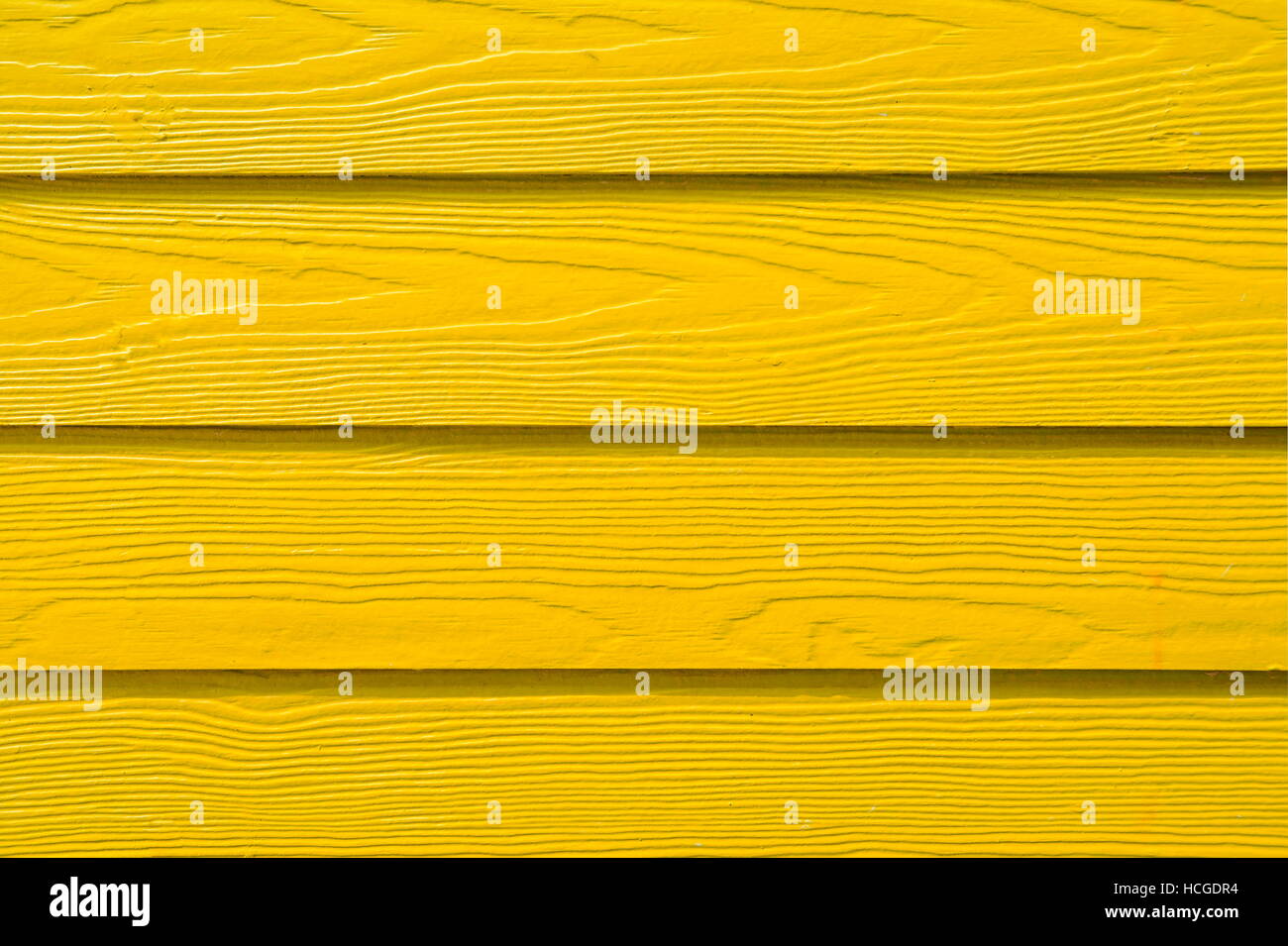 Bunte hölzerne Bords in gelb lackiert. Holz-Hintergrund Stockfoto