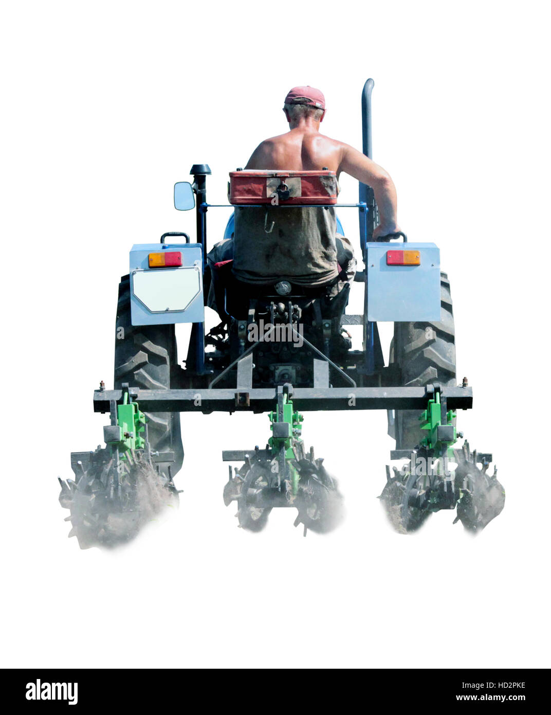 Mann fährt einen Traktor mit spezieller Ausrüstung für Unkraut in der Landwirtschaft isoliert Stockfoto