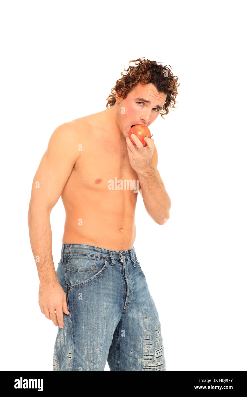 junger Mann Essen Apfel isoliert auf weißem Hintergrund Stockfoto