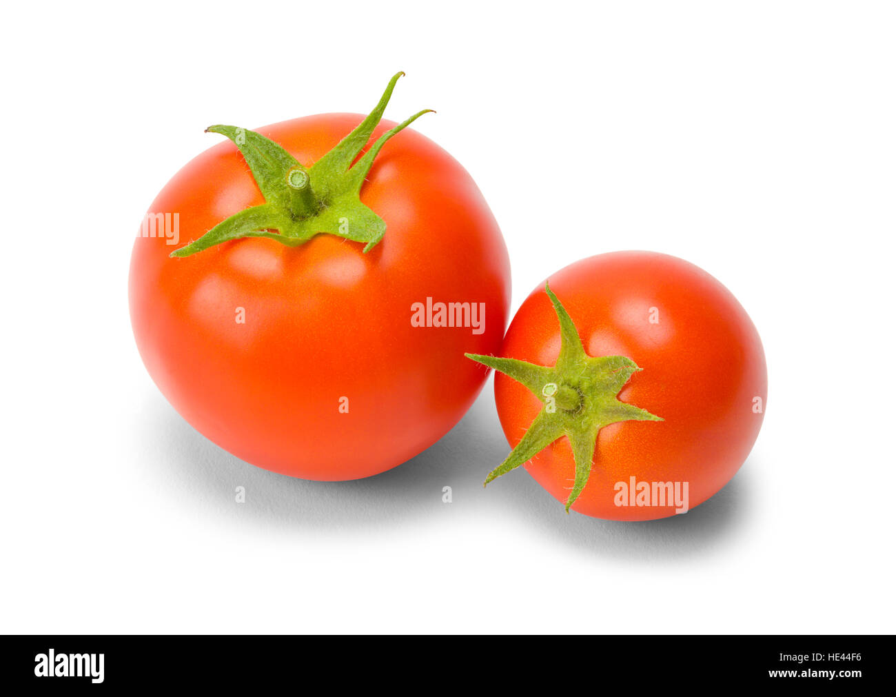 Zwei rote Tomaten in verschiedenen Größen, Isolated on White Background. Stockfoto