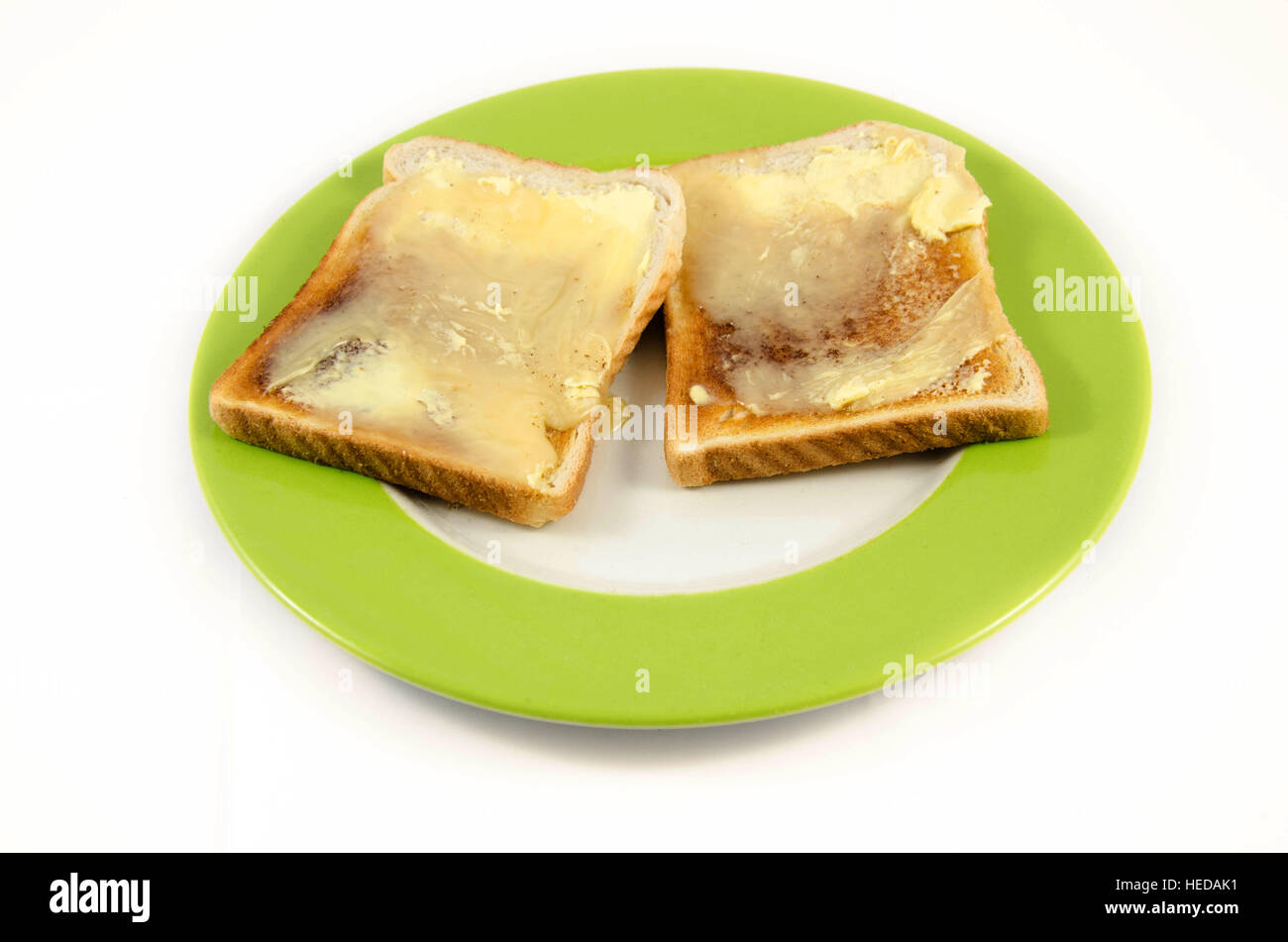Butter und Honig auf Toast. Stockfoto