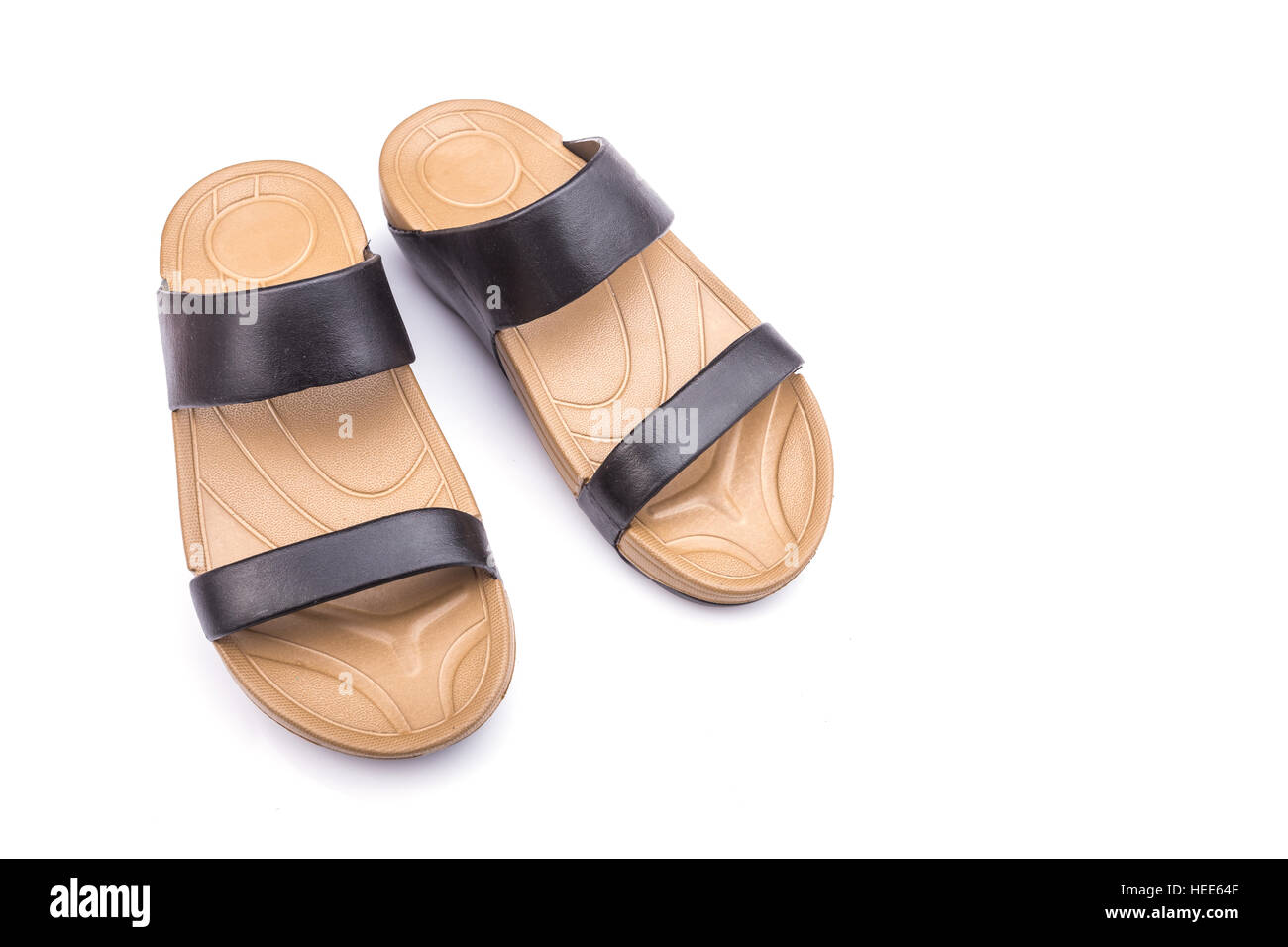 Neue braune Sandalsshoes für Dame isoliert auf weißem Hintergrund Stockfoto