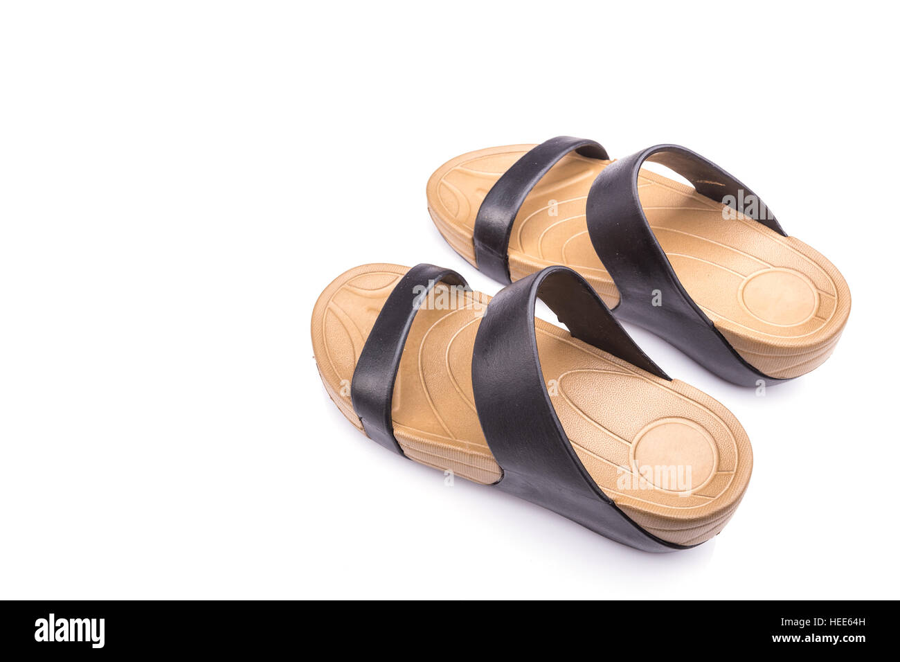 Neue braune Sandalsshoes für Dame isoliert auf weißem Hintergrund Stockfoto