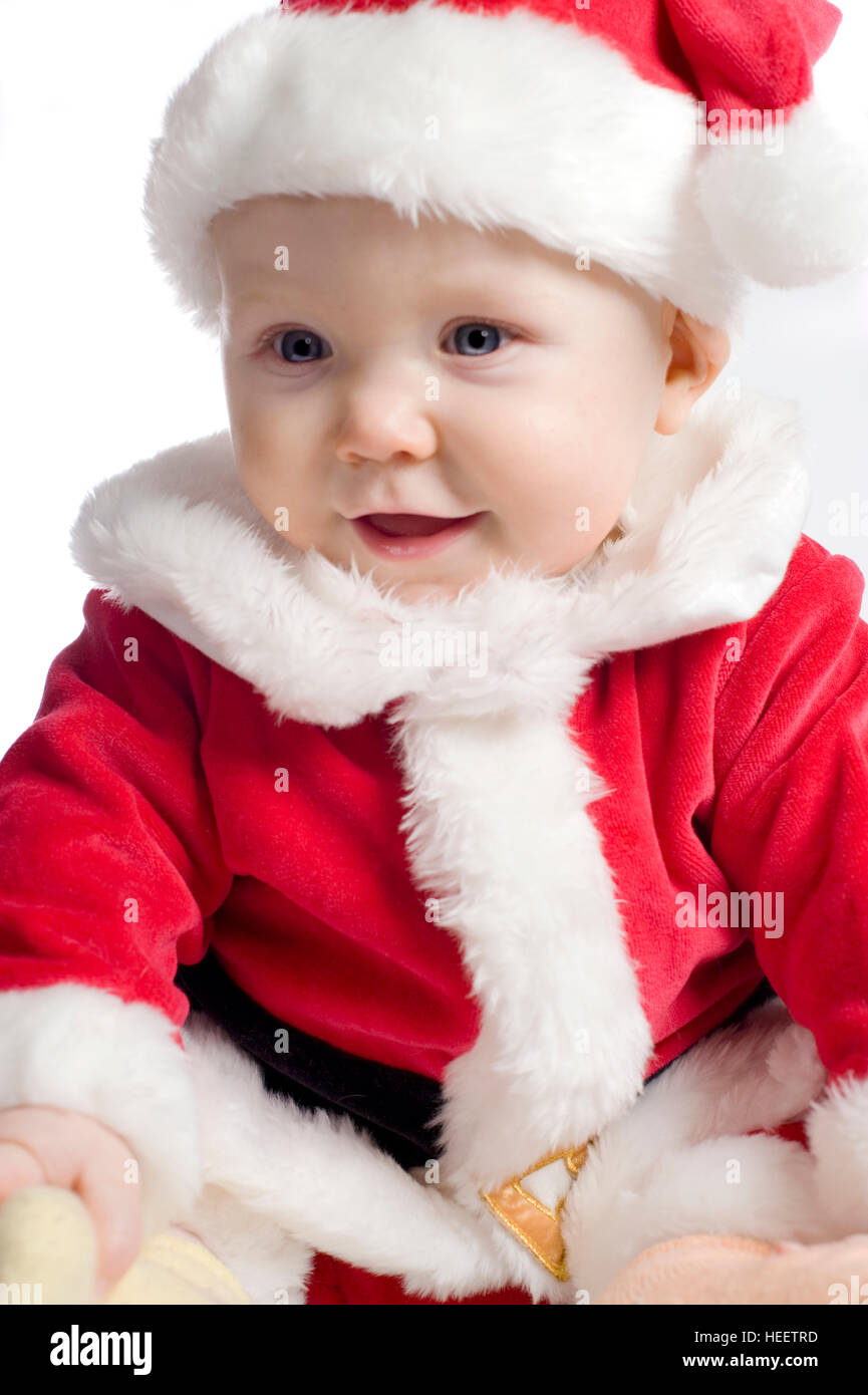 Baby Boy, ca. 6 Monate alt, gekleidet in ein Weihnachtsmannkostüm zu Weihnachten, Stockfoto