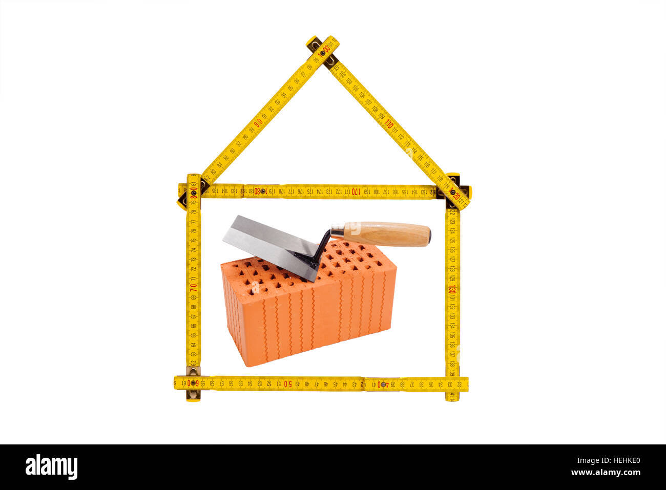Logo für Haus und Bau mit Ziegel und Zollstock Stockfoto