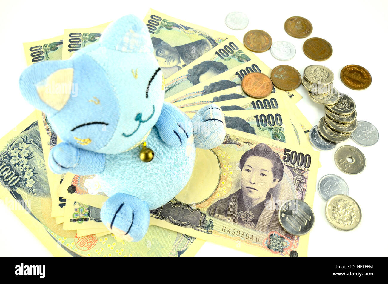 Maneki-Neko, die glückliche Katze und japanische Geld. Stockfoto