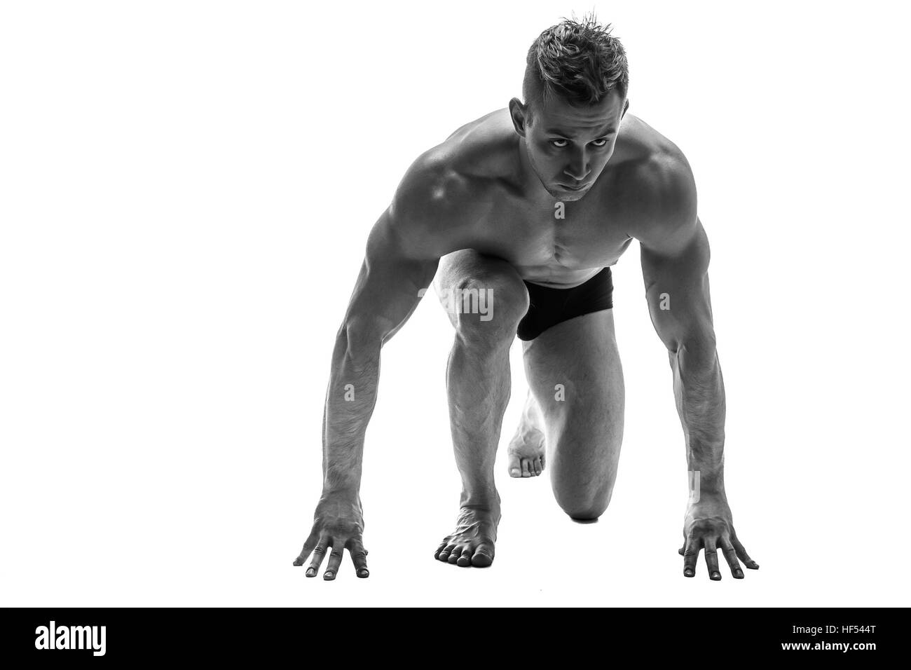 Mann für den Betrieb vorbereiten. Silhouette. isolieren Sie auf weiß. Schwarz / weiß Foto Stockfoto