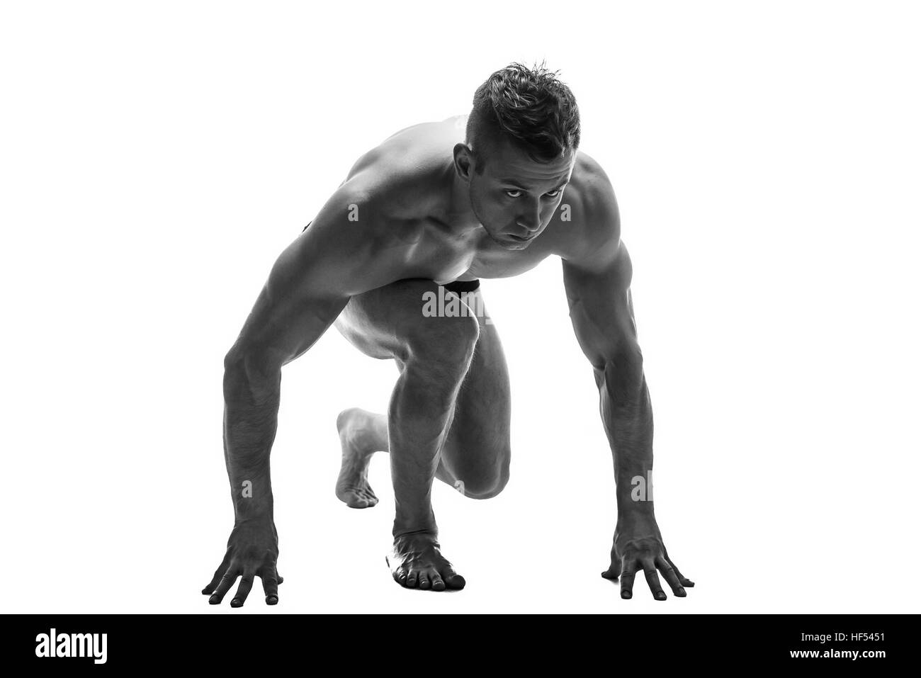 Mann für den Betrieb vorbereiten. Silhouette. isolieren Sie auf weiß. Schwarz / weiß Foto Stockfoto