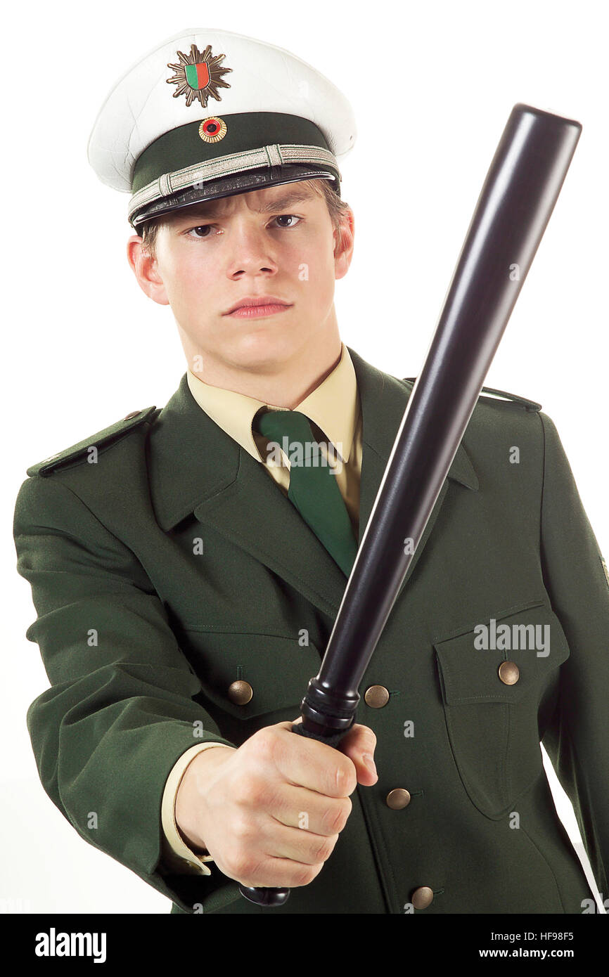 Junge Polizist Holding baton Stockfoto