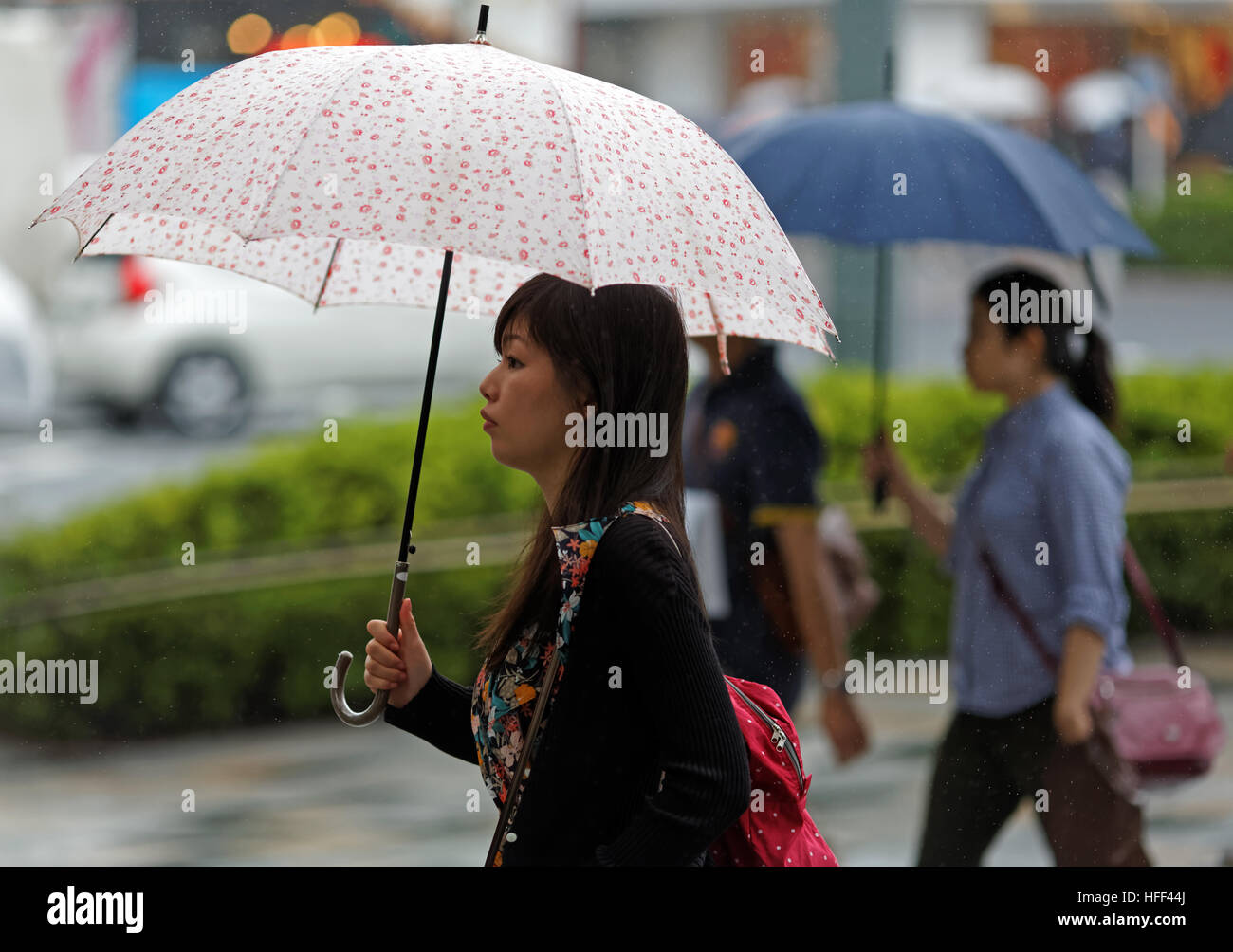 Japan Mädchen mit Regenschirm Stockfoto