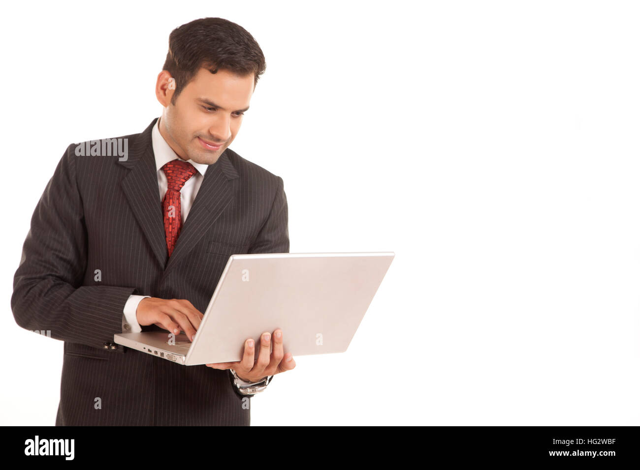 Geschäftsmann mit einem Laptop - über einem weißen Hintergrund isoliert Stockfoto Geschäftsmann mit einem Laptop - über einem weißen Hintergrund isoliert Stockfoto