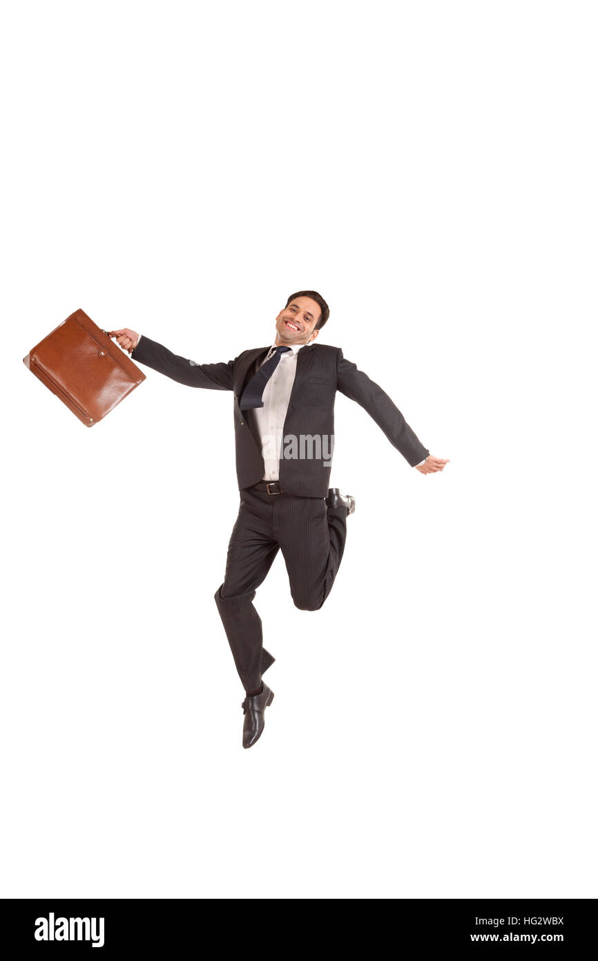 Portrait einer jungen aufgeregt Geschäftsmann springen in die Luft Stockfoto Portrait einer jungen aufgeregt Geschäftsmann springen in die Luft Stockfoto