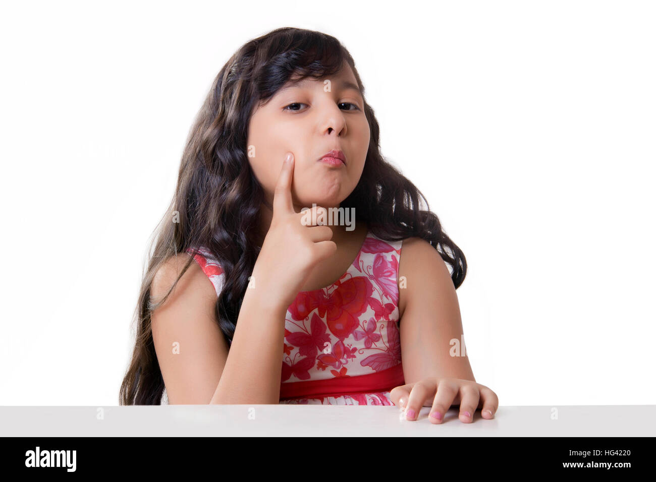 Porträt eines Mädchens mit der Hand auf die Wange Stockfoto