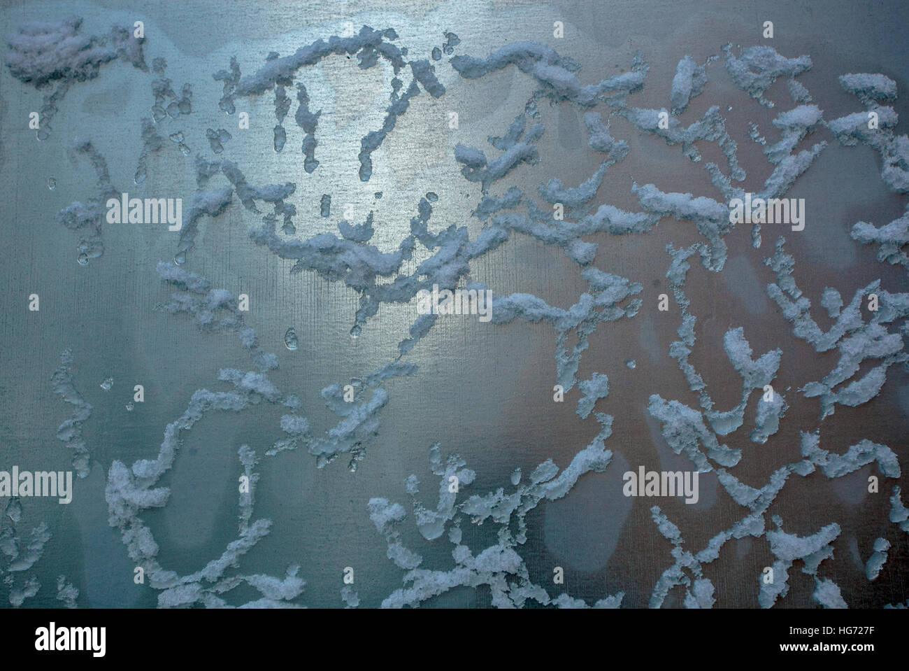 Eis auf metallische Fläche Stockfoto