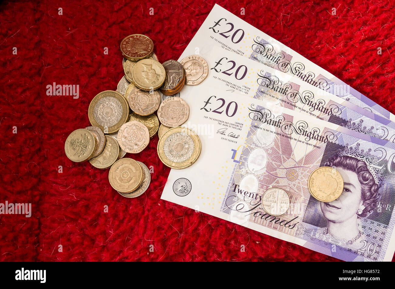 UK britische Banknoten und Münzen Stockfoto