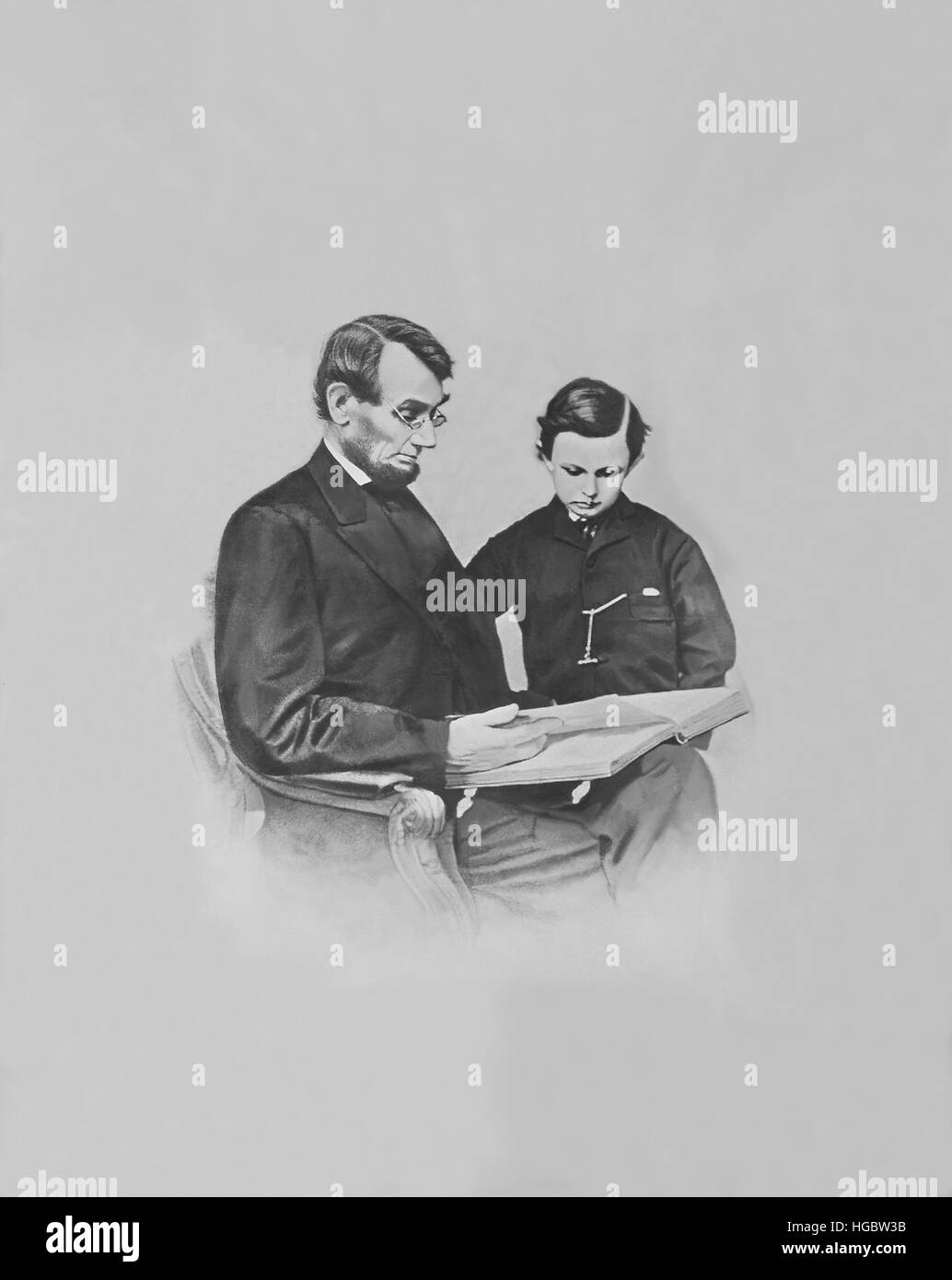 Präsident Abraham Lincoln und sein Sohn Tad Lincoln ein Buch betrachten. Stockfoto