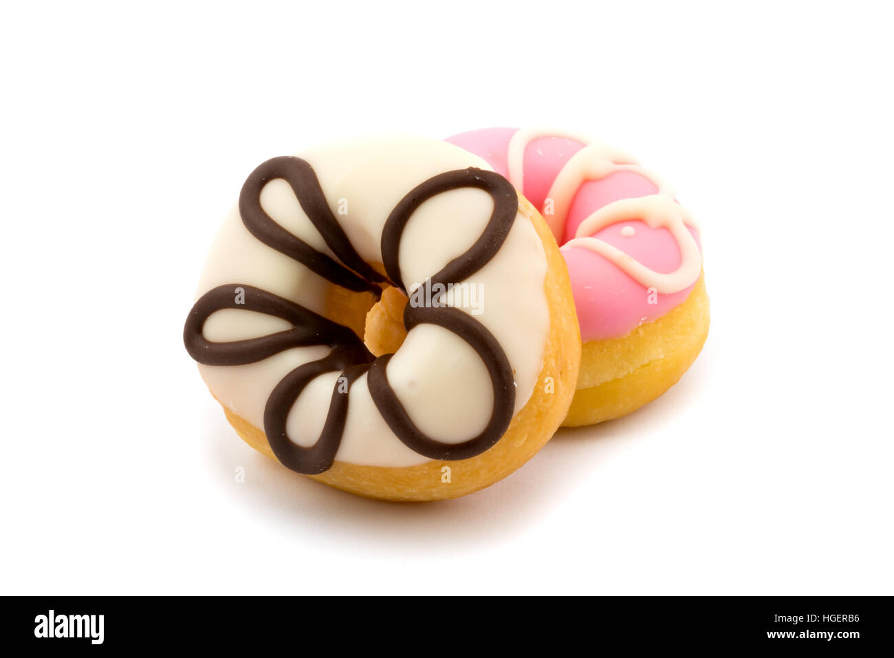 Leckere Donuts mit Zuckerguss auf weißem Hintergrund Stockfoto