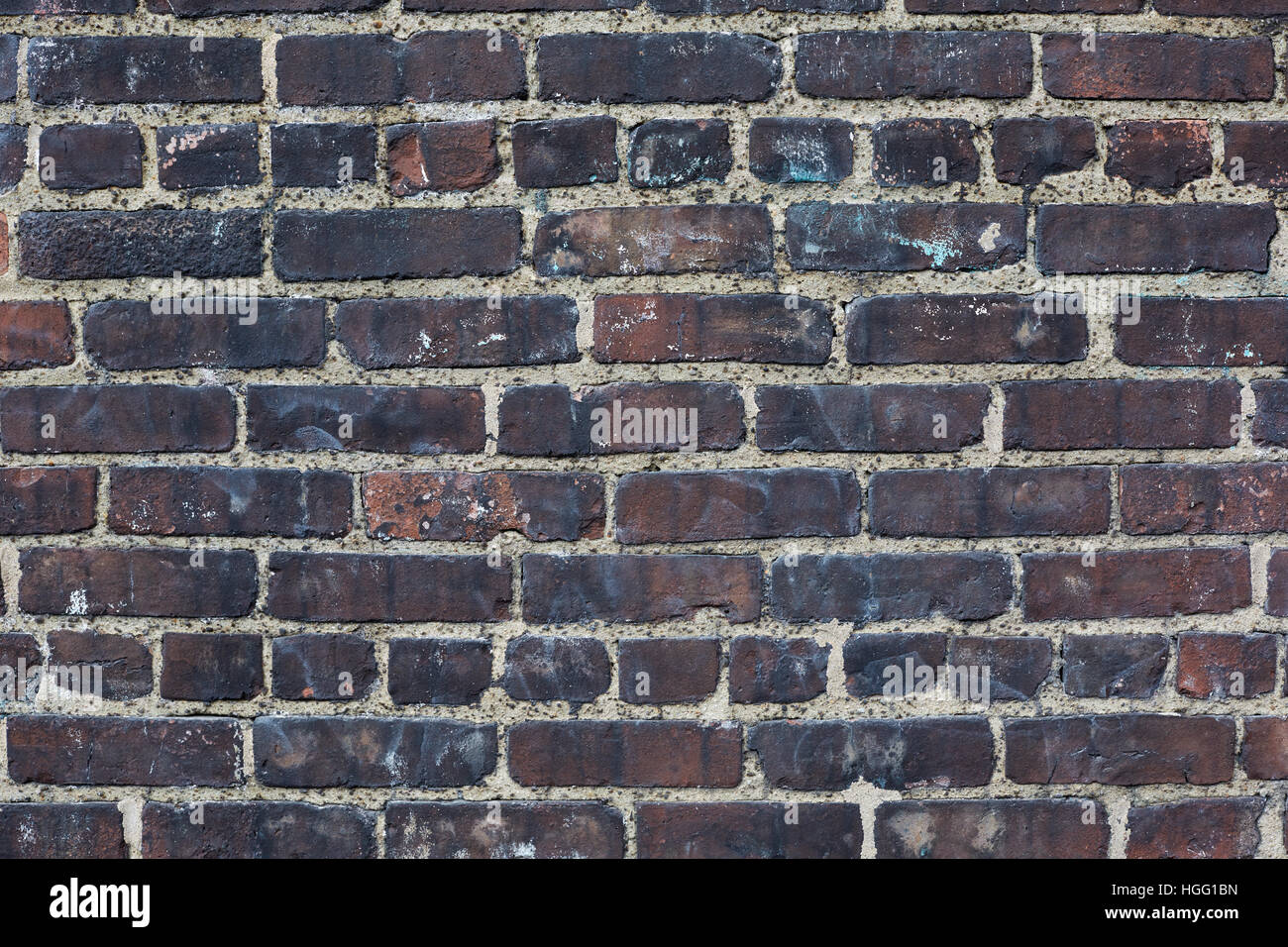 Dunklen Ziegeln, schwärzen verwitterte Wand Textur Hintergrund Stockfoto