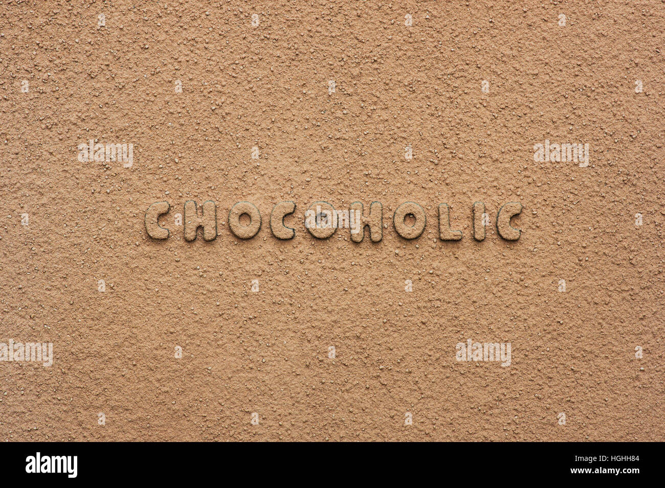 Schokolade Chocoholic Briefe mit Kakaopulver bedeckt Stockfoto