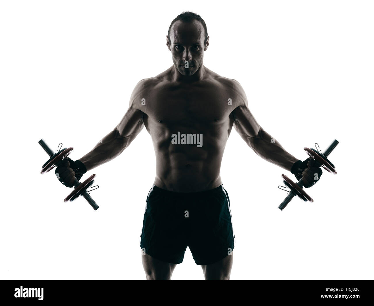 ein kaukasischer Mann trainieren Fitness Bodybuilding-Übungen im Studio Silhouette isoliert Stockfoto