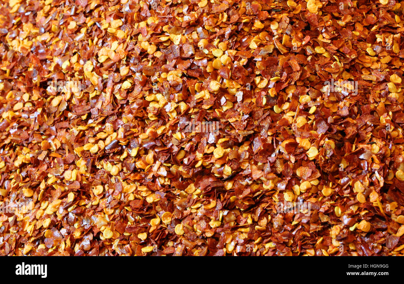 scharfe Gewürze Hintergrund mit Chili-Paprika und Petersilie Stockfoto