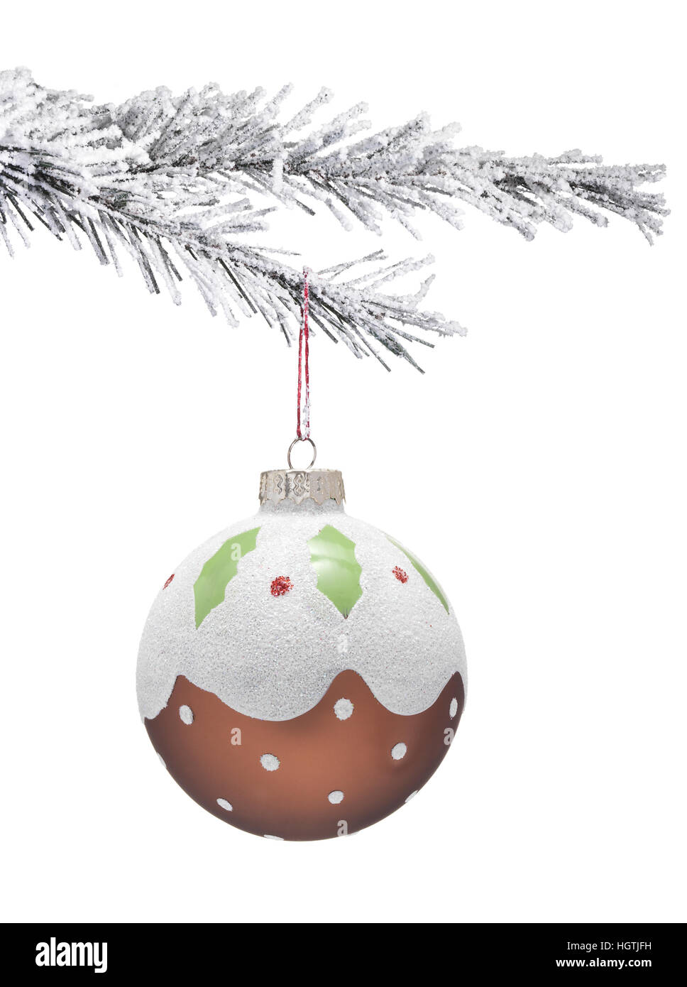 Weihnachtsbaum mit Schnee und ein Pudding Christbaumkugel Stockfoto