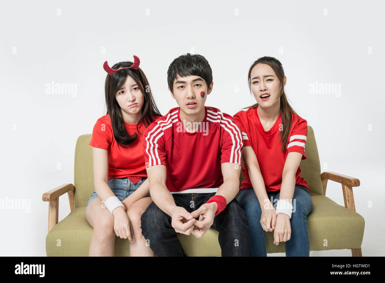 Young Korean Red Devil Cheerleader enttäuscht Stockfoto
