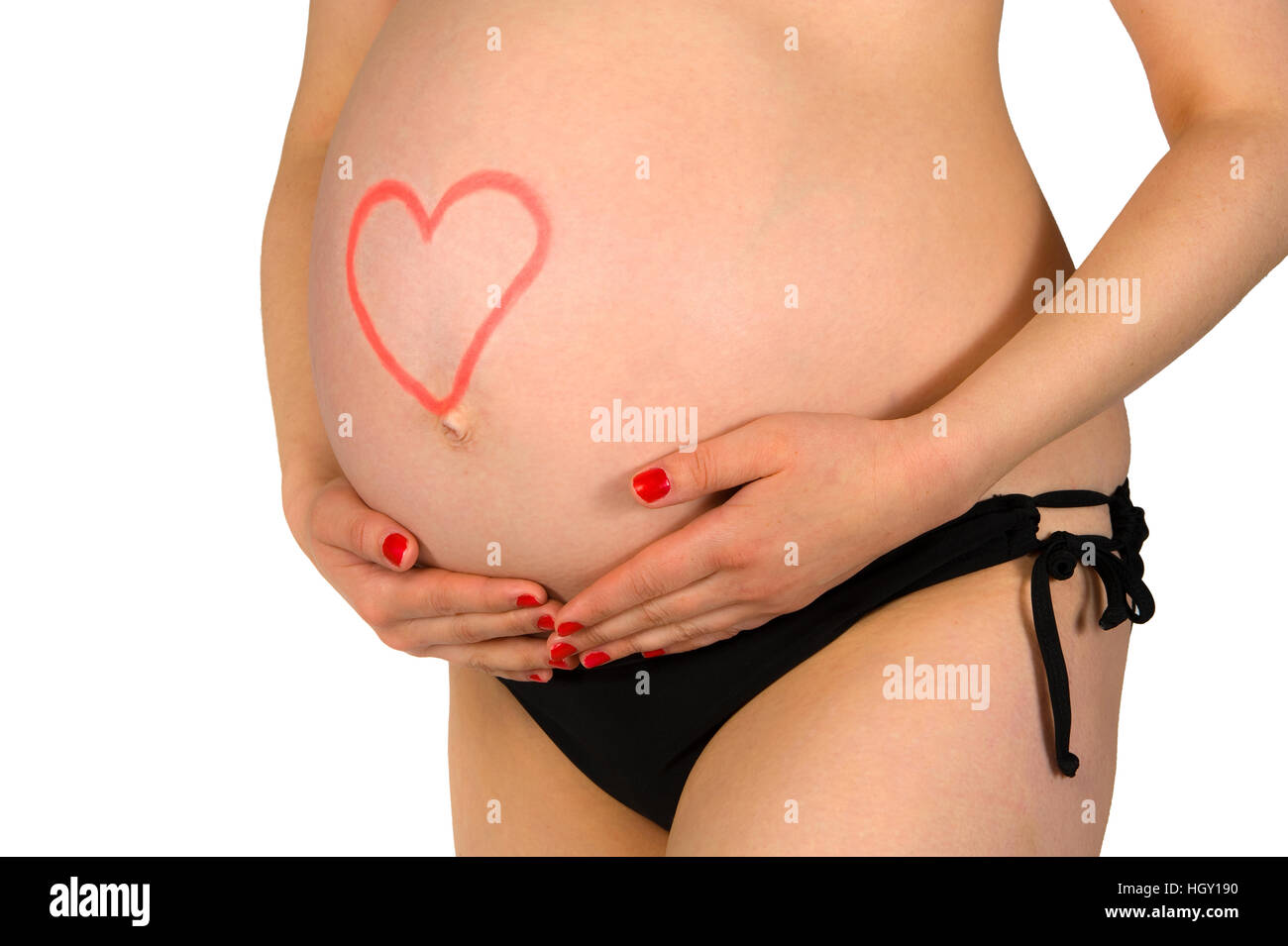 Schwangere Frau mit Herz geschrieben mit Lippenstift auf den Bauch Stockfoto