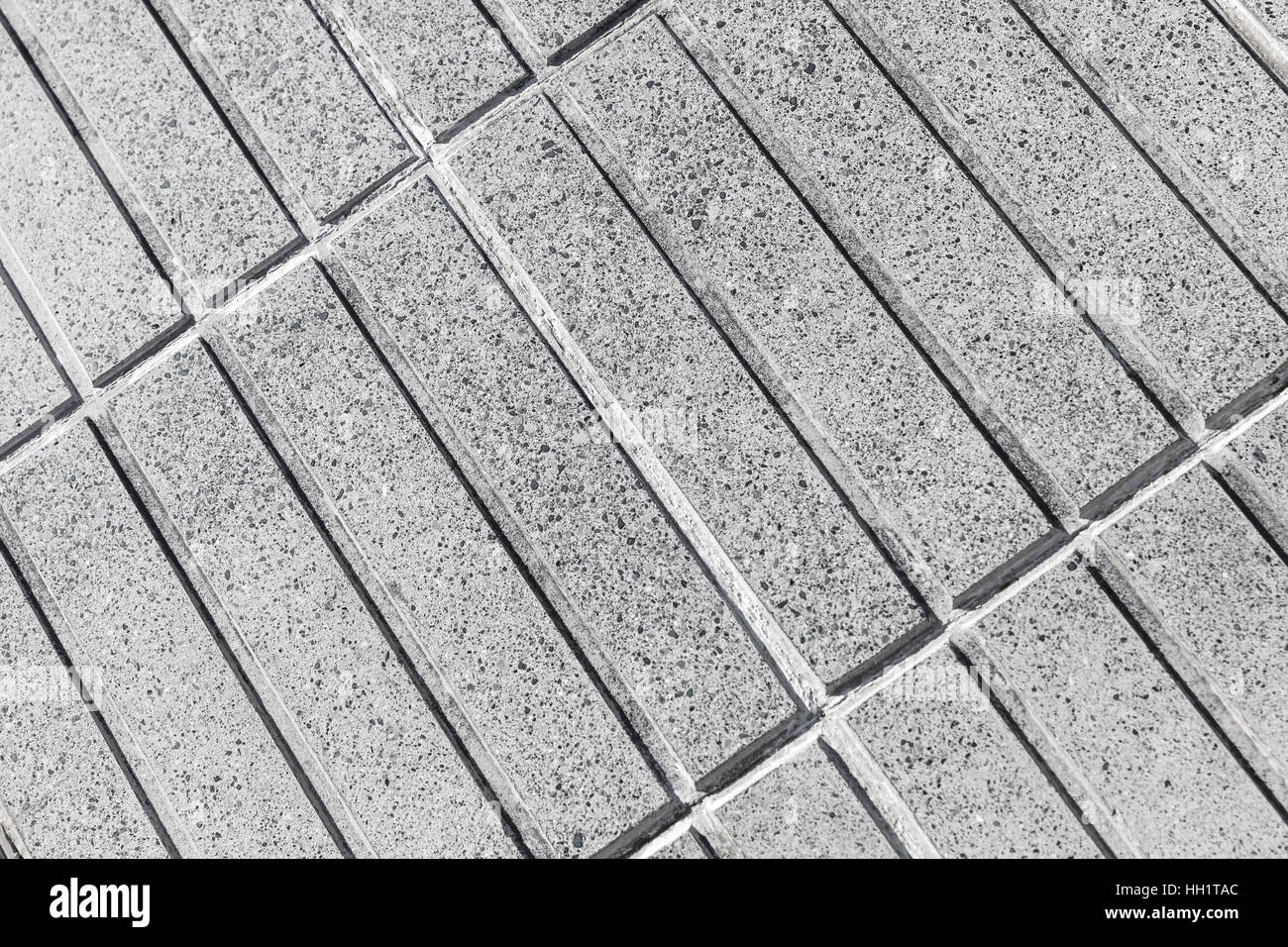 Graue Betonwand mit Rechteck Reliefmuster, Foto Hintergrundtextur Stockfoto