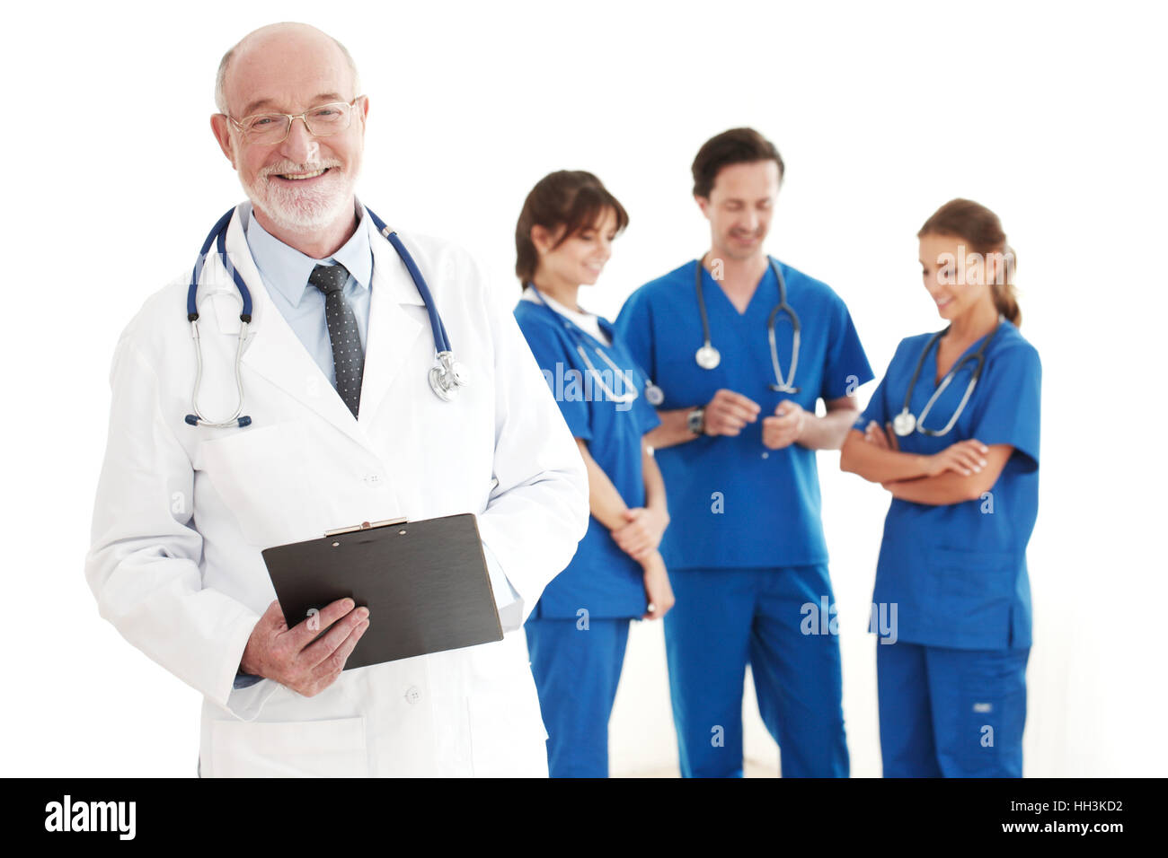Lächelnd Team von Ärzten und Krankenschwestern auf weißem Hintergrund Stockfoto
