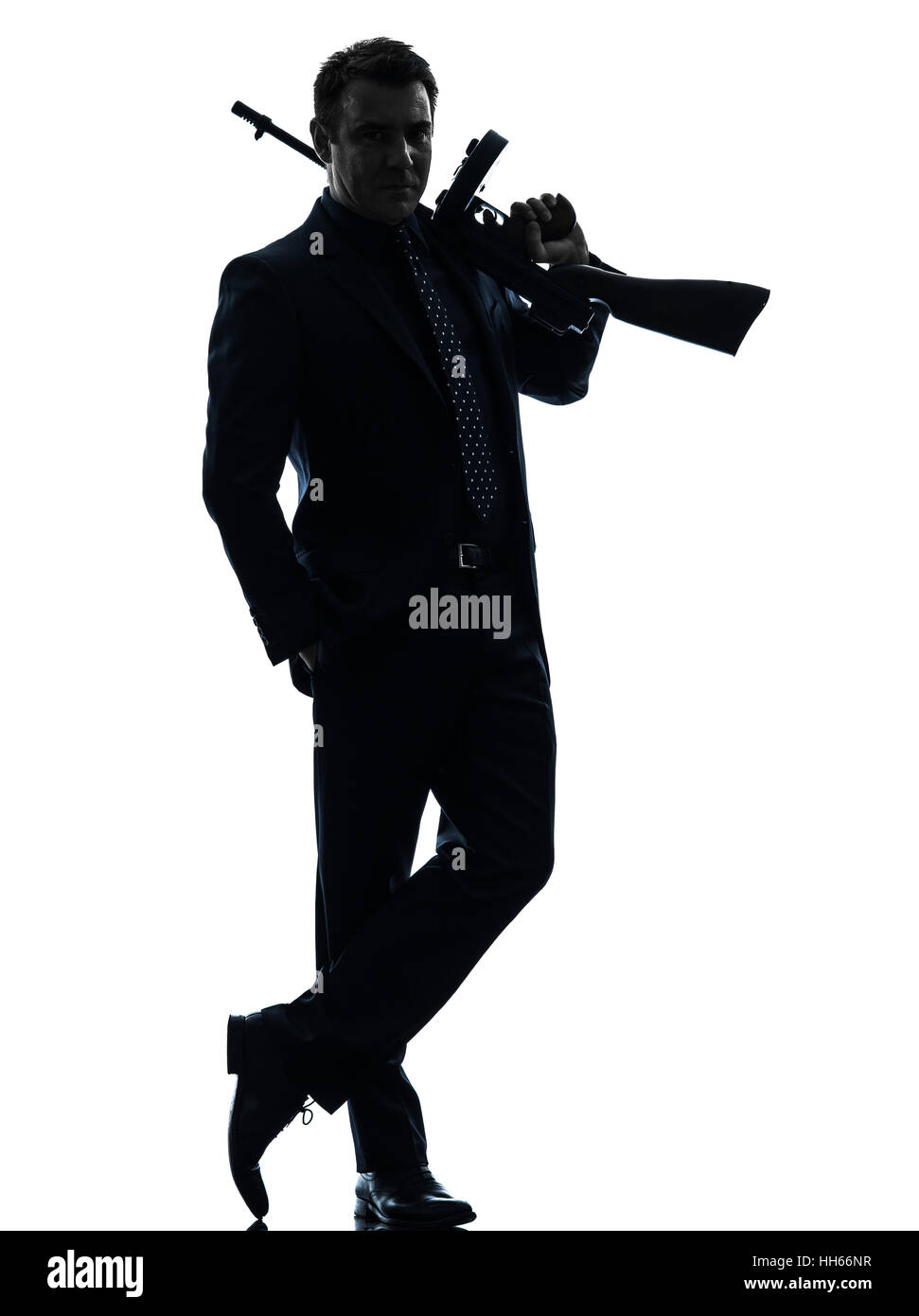 ein Mann hält Thompson Maschinengewehr in der Silhouette auf weißem Hintergrund Stockfoto