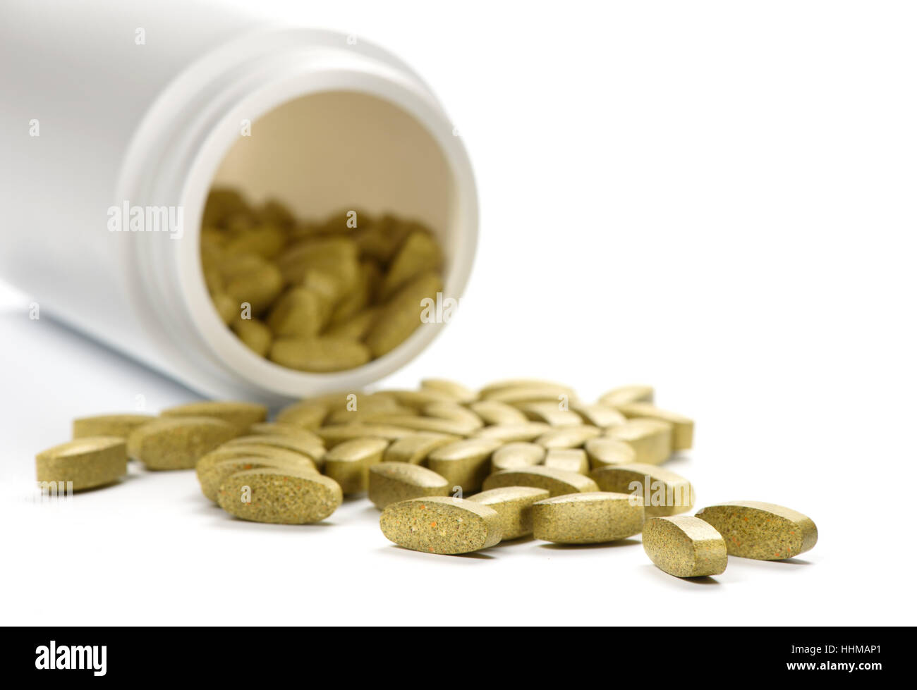 Grün Tabletten mit medizinischen Flasche. Nahrungsergänzungsmittel auf weißem Hintergrund Stockfoto