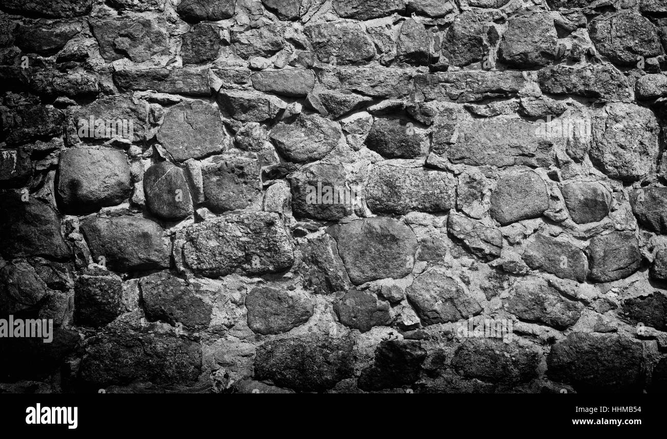 natürliche Stein alte Wand Hintergrund. Boulder-Textur Stockfoto
