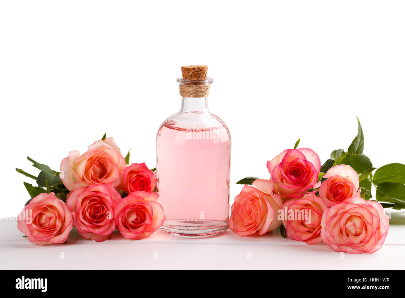 Pink rose ätherische, massage-Öl isoliert auf weiß Stockfoto