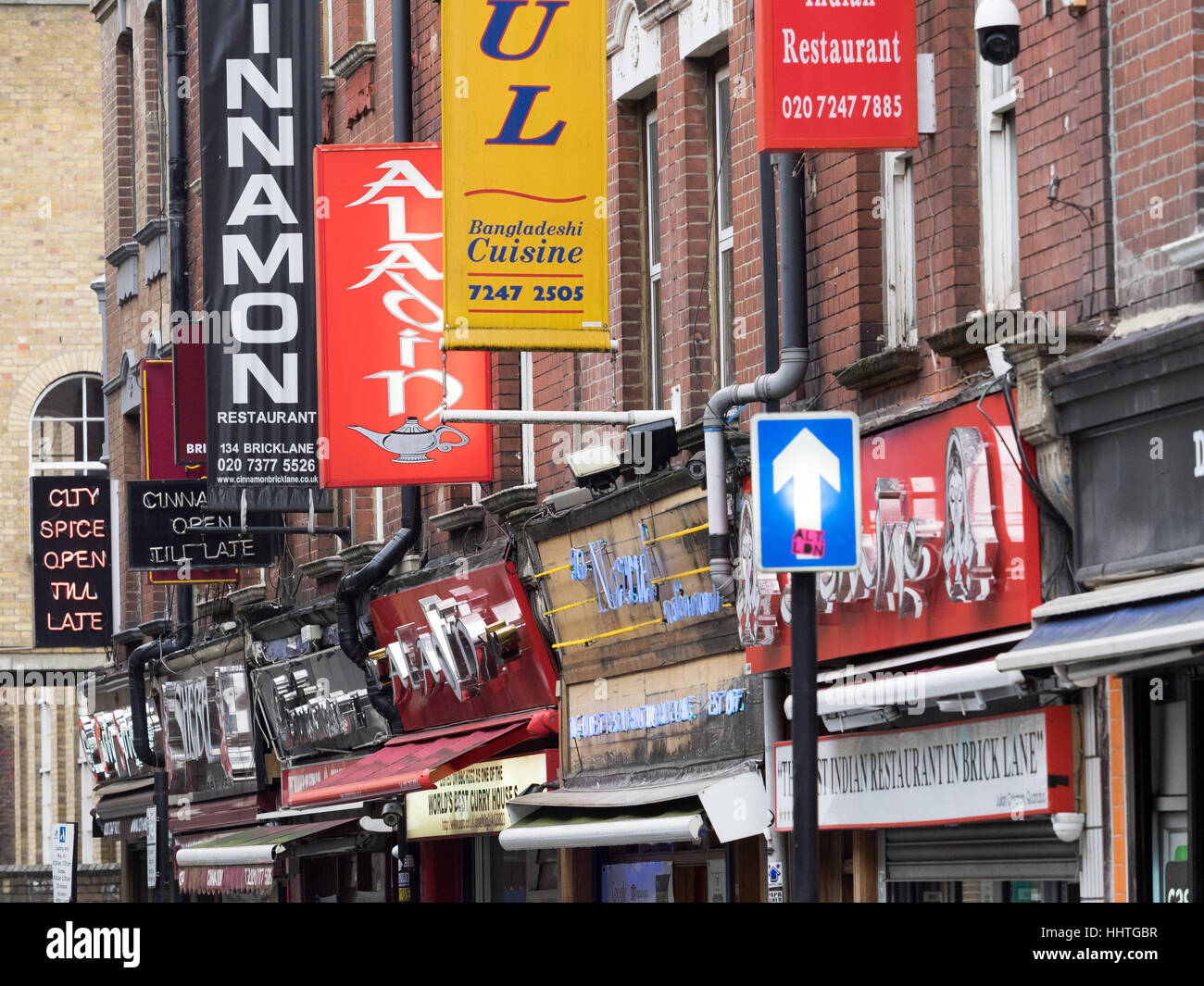 Restaurant-Zeichen im Brick Lane, London East End Stockfoto