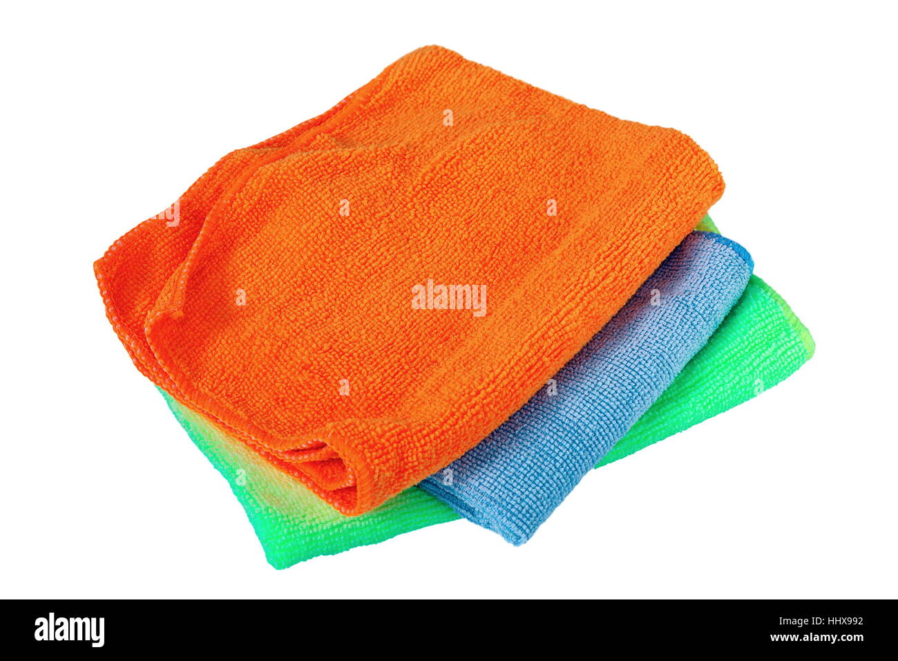 Stapel von drei Handtücher isoliert auf weißem Hintergrund (Orange, blau, grün) Stockfoto