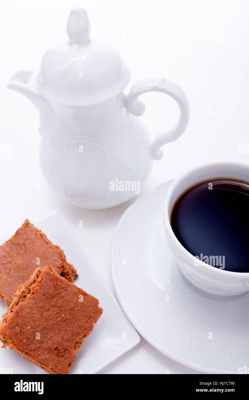 frische Kekse mit einer Kanne Kaffee und eine Tasse Stockfoto