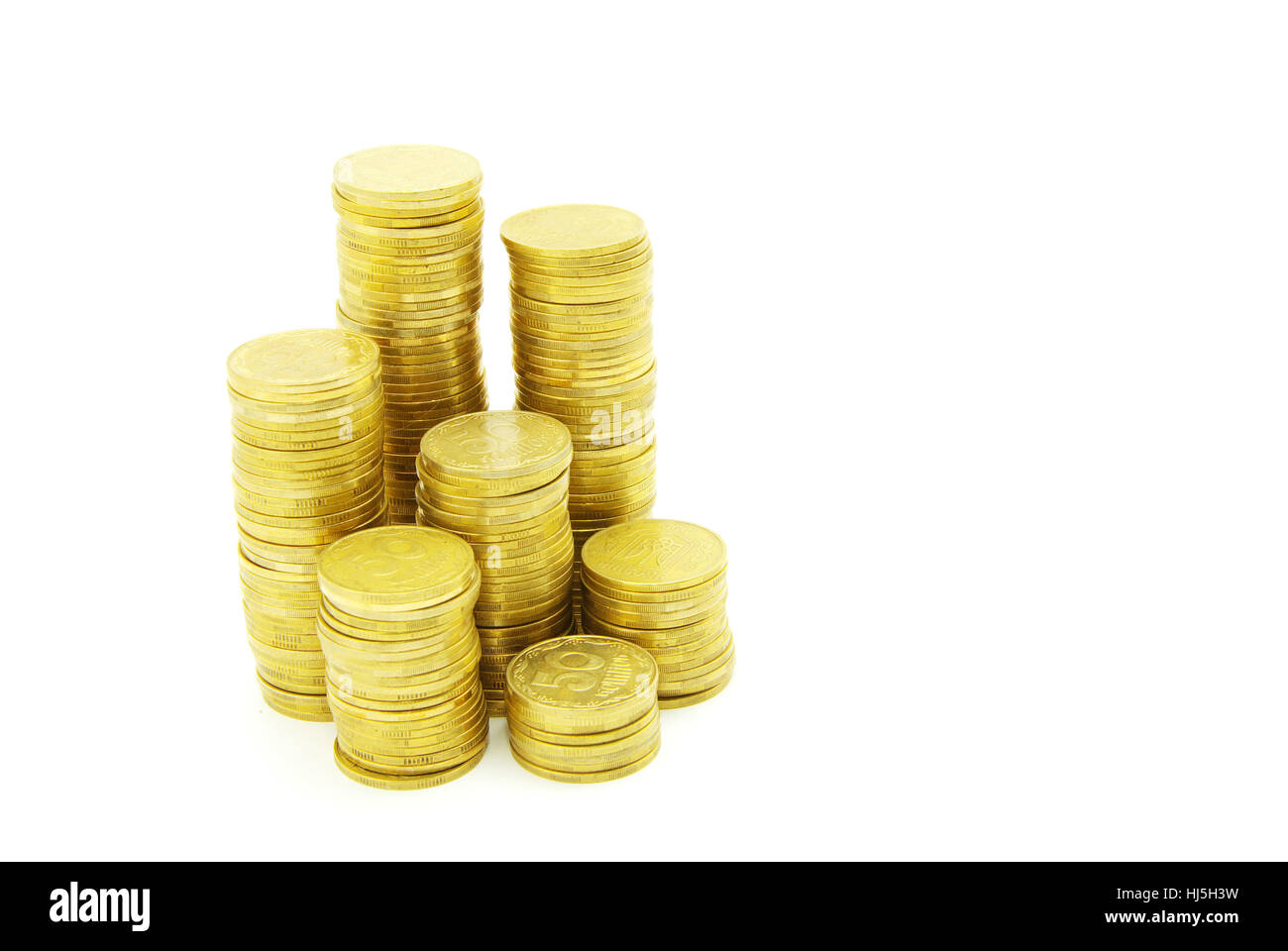 Türme der Münzen isoliert auf eine weiße Stockfoto